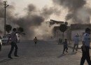 Smoke rises over the streets after an mortar bomb landed from Syria in the border village of Akcakale, southeastern Sanliurfa province